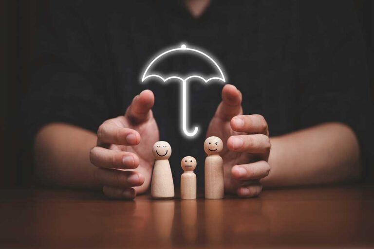 Driver reviews an auto insurance declarations page beside car keys and a parked vehicle.